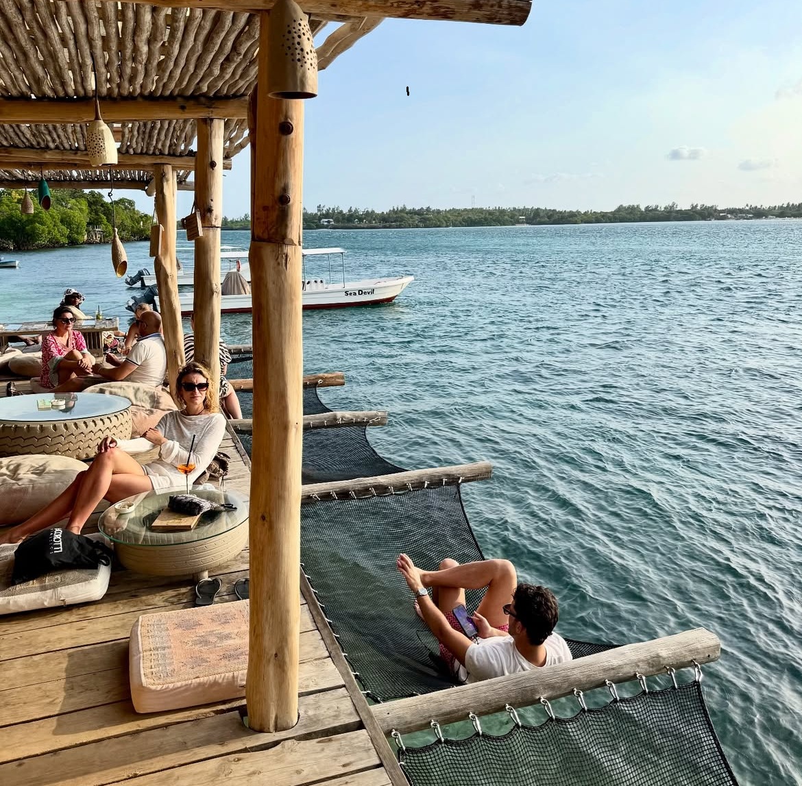 Guests relaxing on an island dhow stop in Watamu