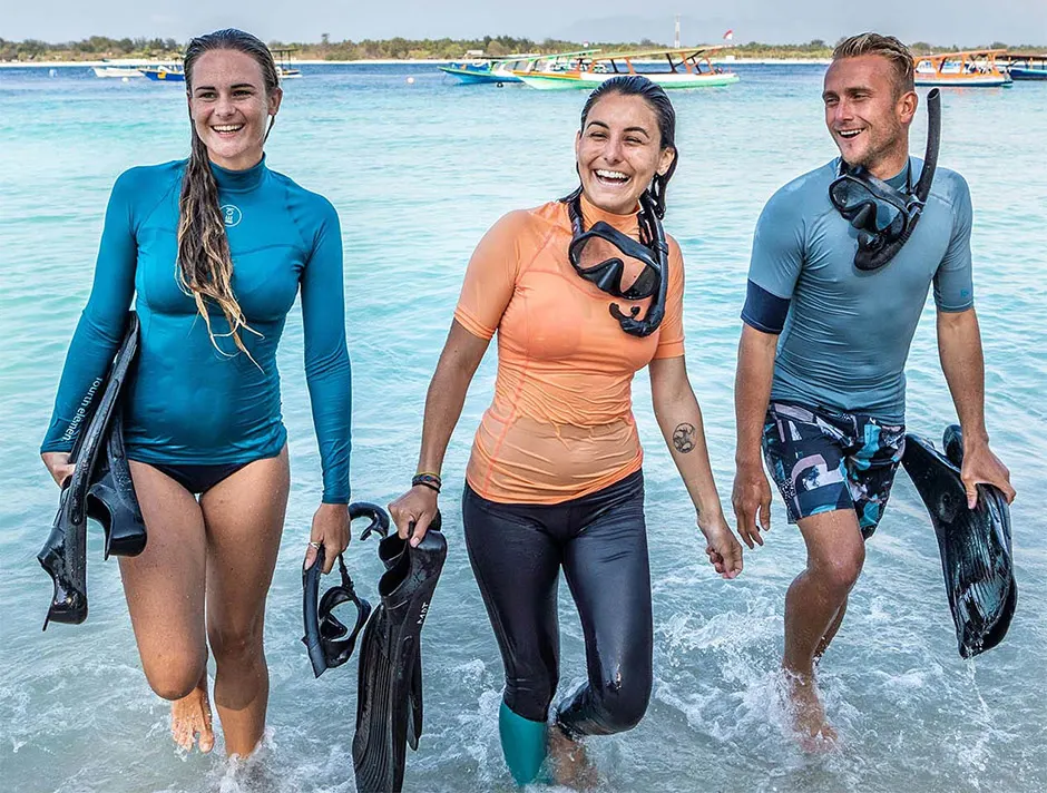 Long-sleeved rash guard worn for sun protection while snorkelling