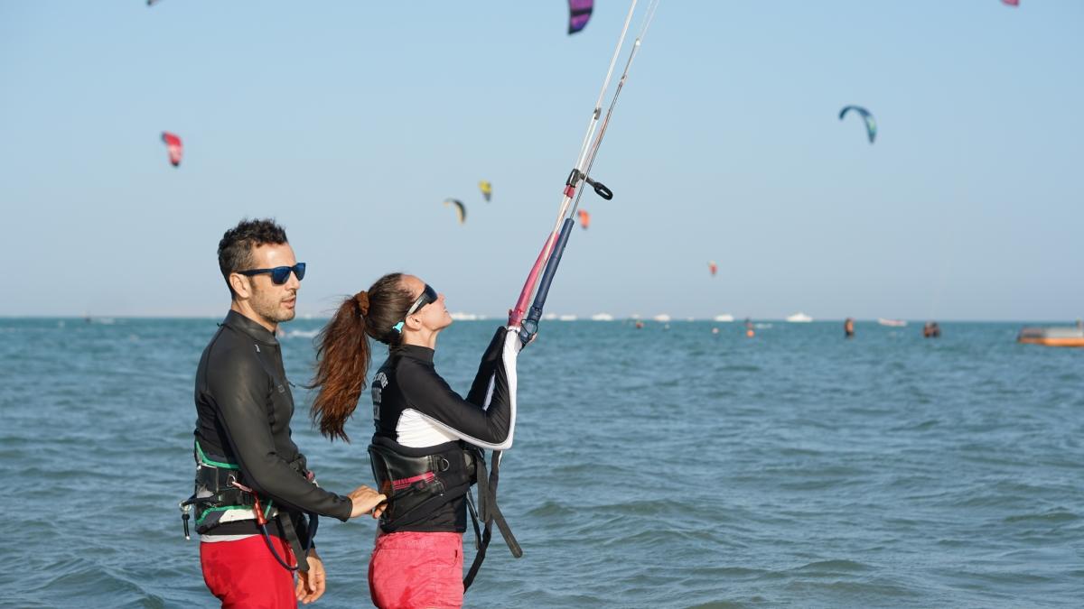 Beginner kite surfing lesson with an instructor on a beach in Watamu
