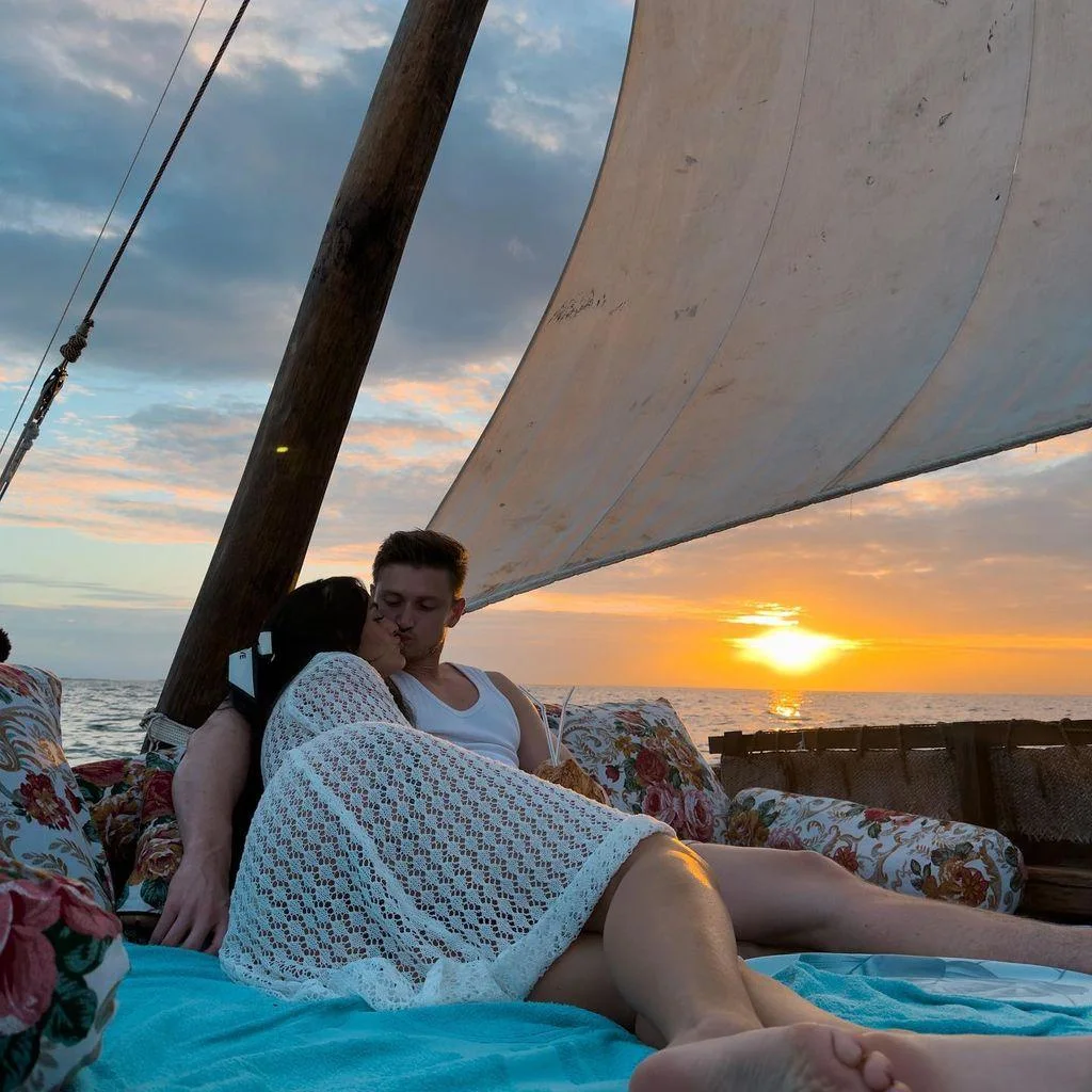 Couple relaxing together during a private dhow sunset cruise in Watamu