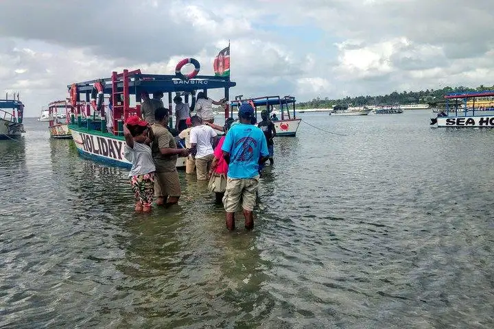 Guests boarding a boat for a Watamu marine excursion