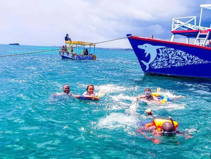 Visitors snorkelling and exploring Watamu Marine Park from a licensed tour boat