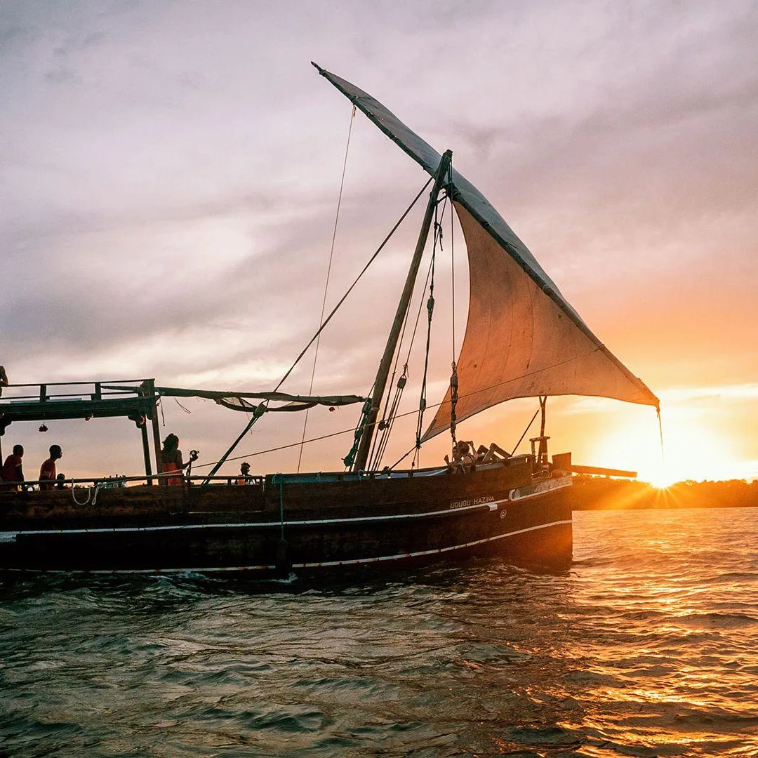 Traditional dhow sailing at sunset on Mida Creek in Watamu, Kenya