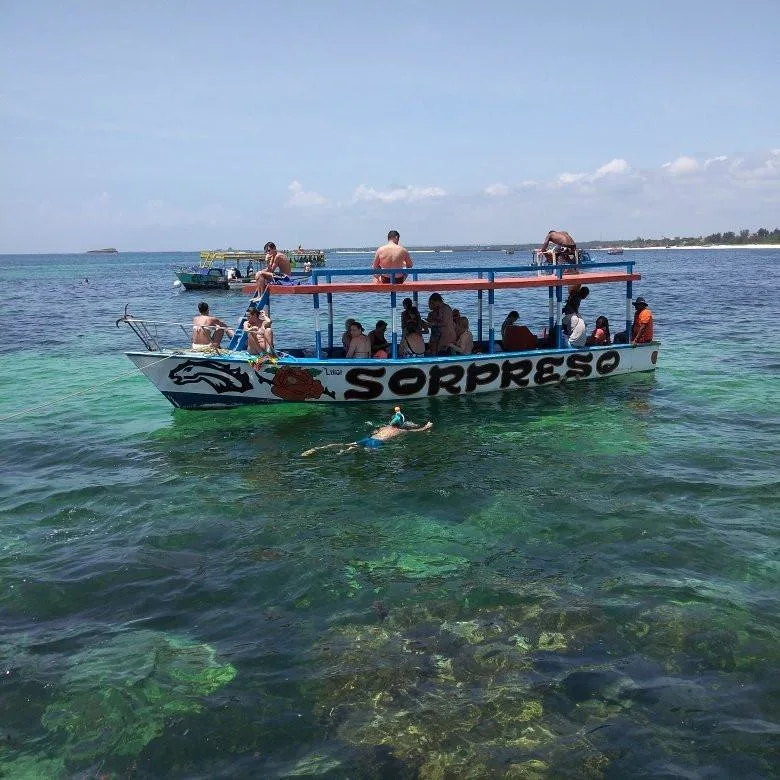 Group of visitors on a shared snorkeling boat in Watamu Marine National Park